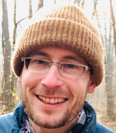 Zach in the woods during Fall